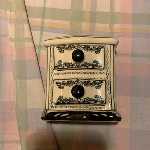 A tiny ceramic china drawer